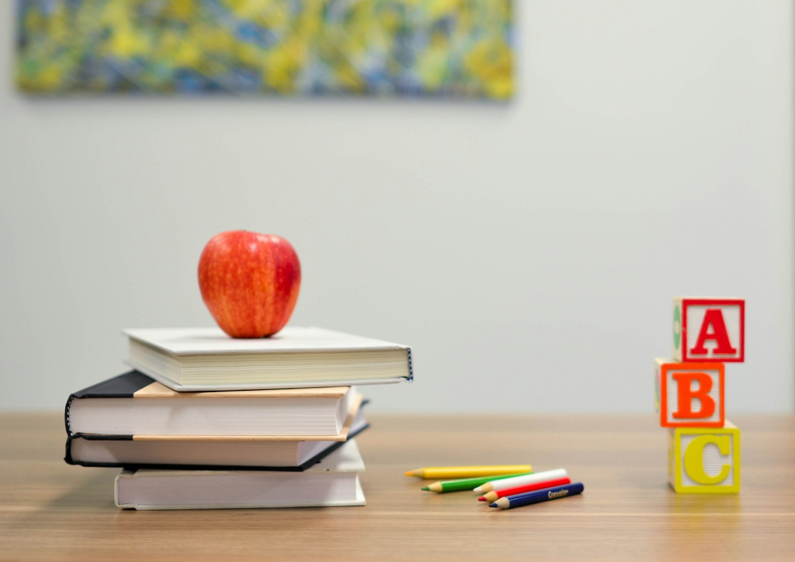 Books and learning blocks on a classroom desk